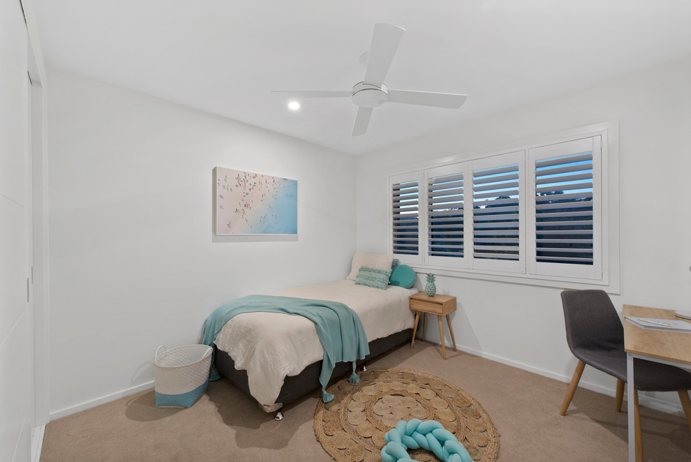 This is an example of a beach style kids' bedroom in Other.