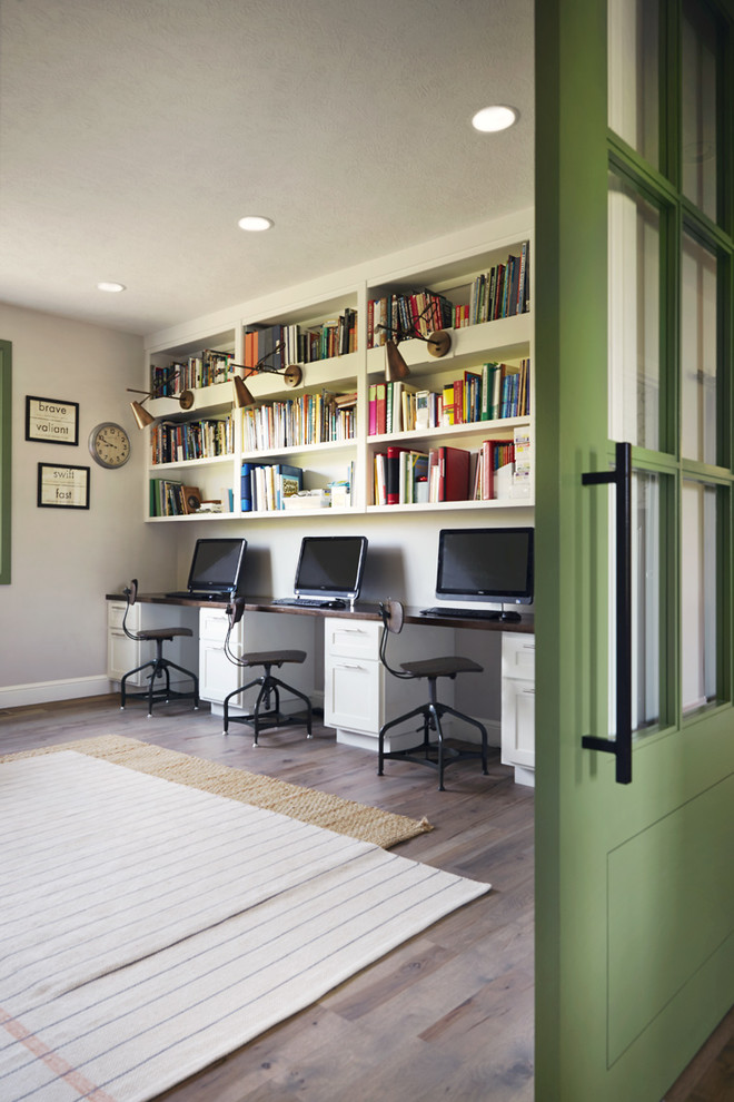Kids' study room - large rustic gender-neutral medium tone wood floor kids' study room idea in Other with gray walls