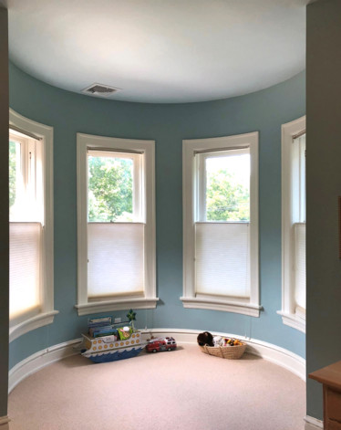 Kids' room - huge victorian gender-neutral carpeted and beige floor kids' room idea in St Louis with blue walls