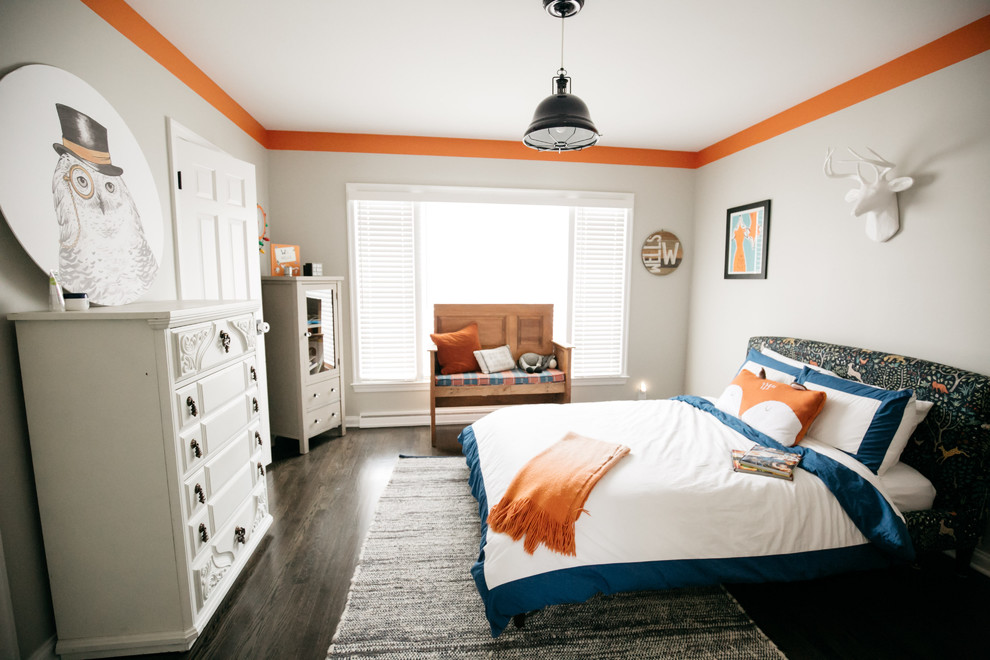 Photo of a traditional kids' bedroom for boys in Indianapolis with grey walls, dark hardwood flooring and brown floors.