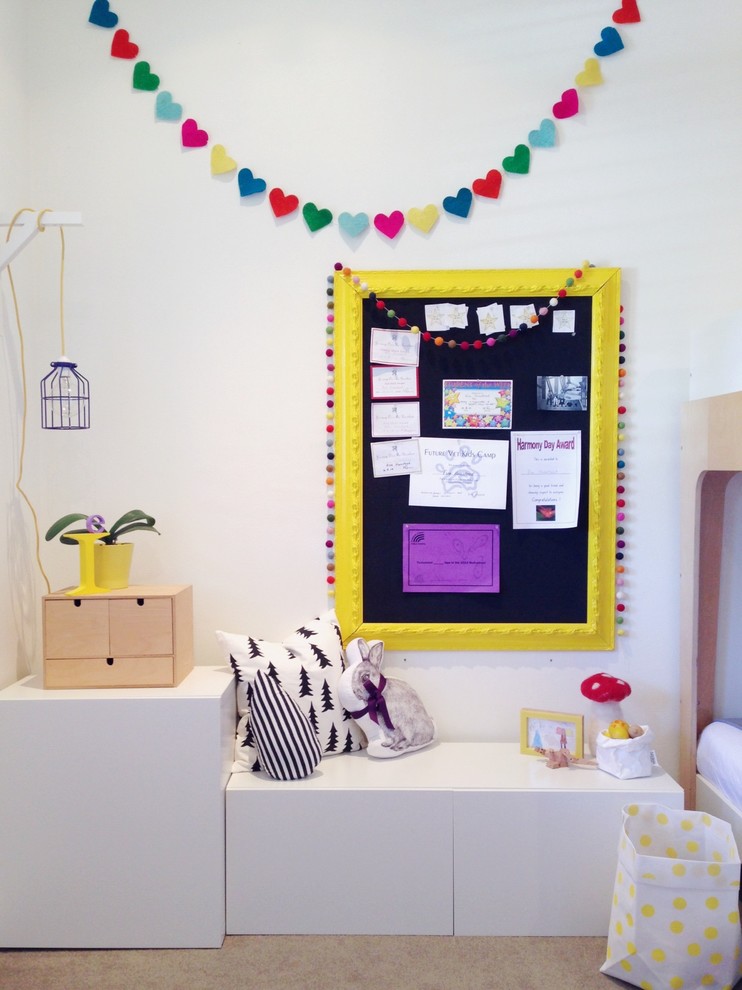 Medium sized modern children’s room for girls in Sydney with white walls and carpet.