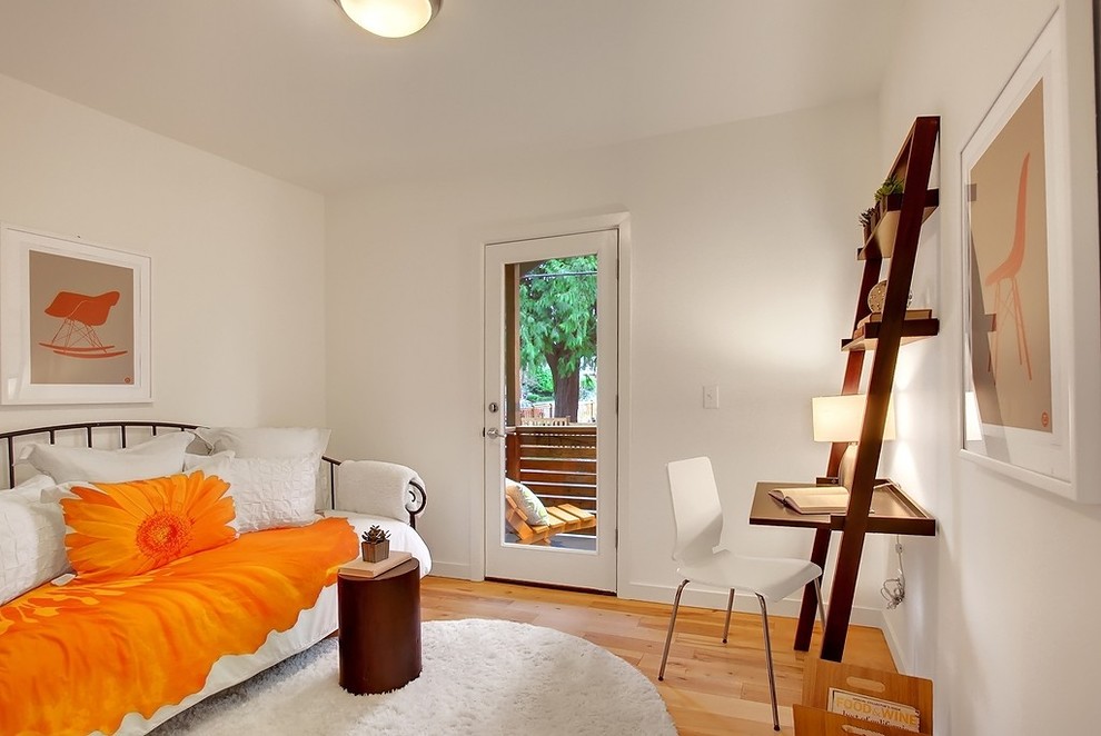 Inspiration for a contemporary girl medium tone wood floor kids' room remodel in Seattle with white walls