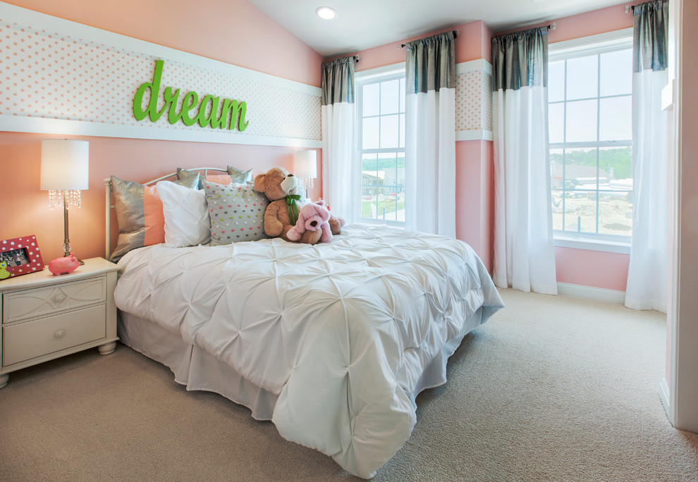 Large classic children’s room for girls in Philadelphia with pink walls and carpet.