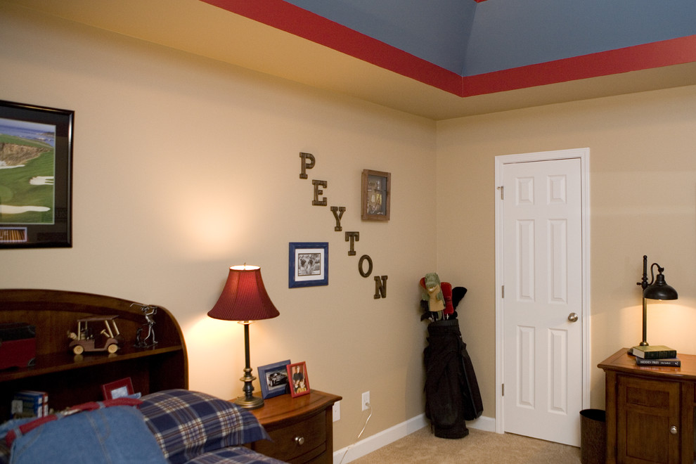 Example of a mid-sized transitional boy carpeted kids' room design in Other with beige walls