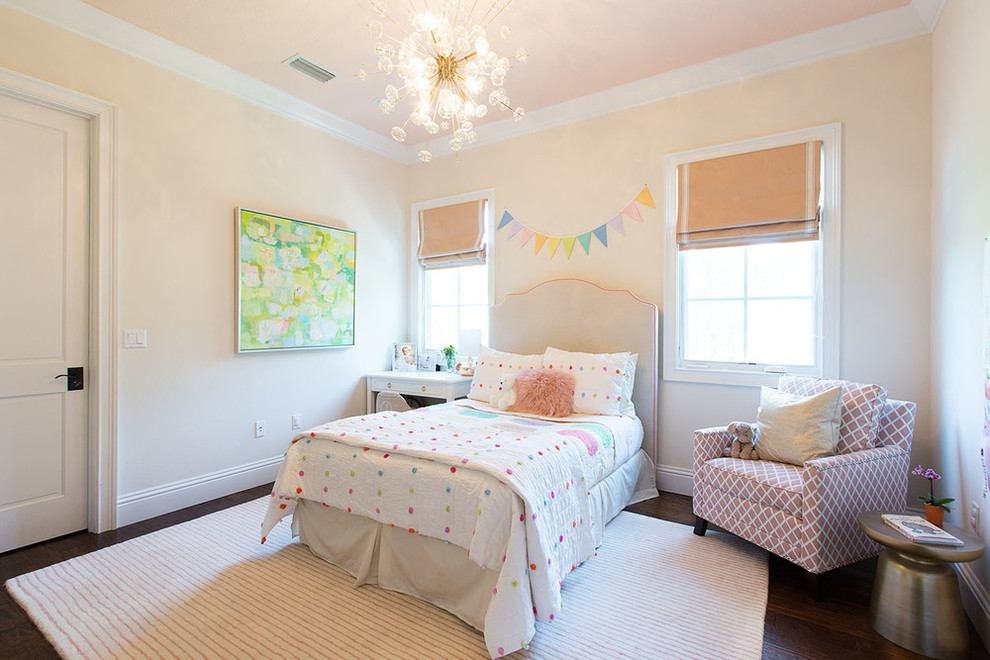 Transitional girl dark wood floor kids' bedroom photo in Orange County with beige walls