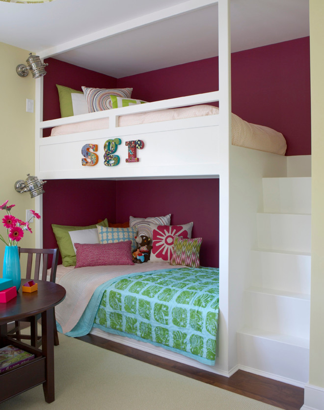 Nautical kids' bedroom for girls in Boston with carpet and multi-coloured walls.