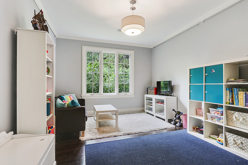 Example of a mid-sized transitional gender-neutral dark wood floor and brown floor kids' room design in Chicago with gray walls