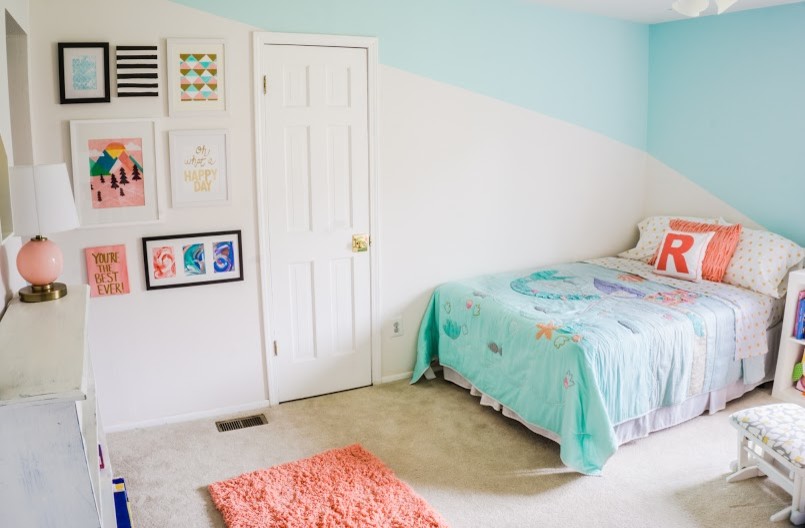 Medium sized classic toddler’s room for girls in Philadelphia with multi-coloured walls and carpet.