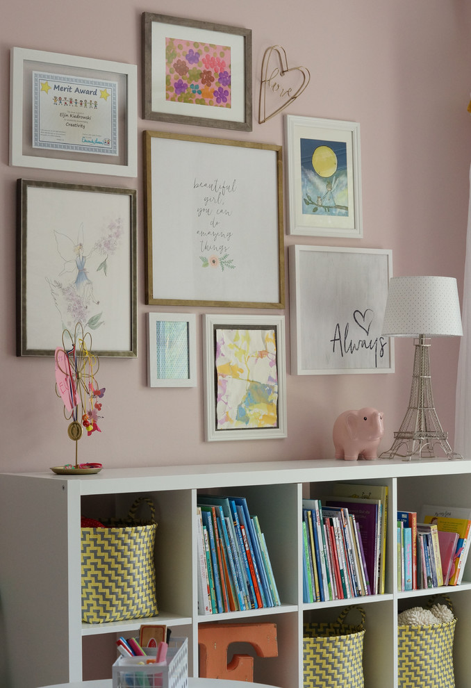 Mid-sized transitional girl carpeted and beige floor kids' room photo in Other with pink walls