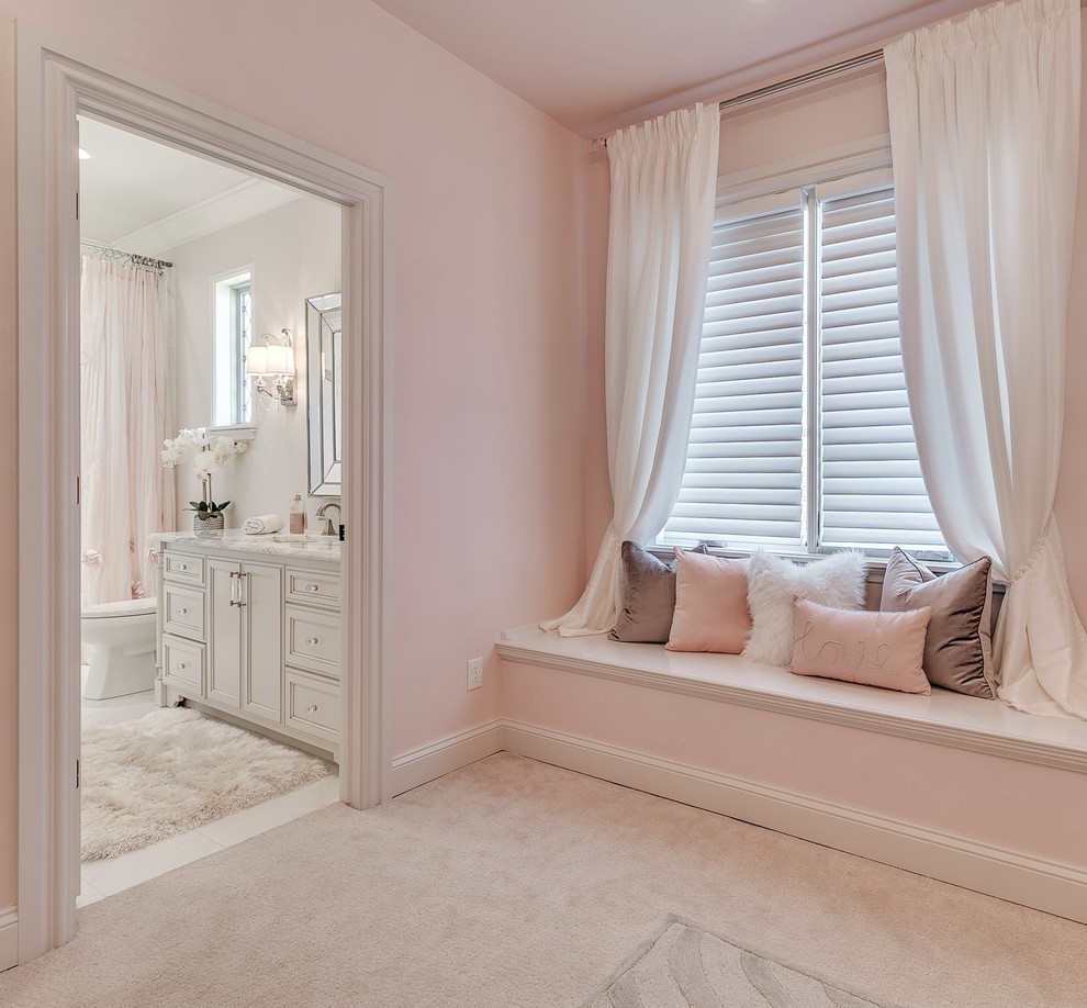 Photo of a medium sized traditional teen’s room for girls in Oklahoma City with pink walls, carpet and beige floors.