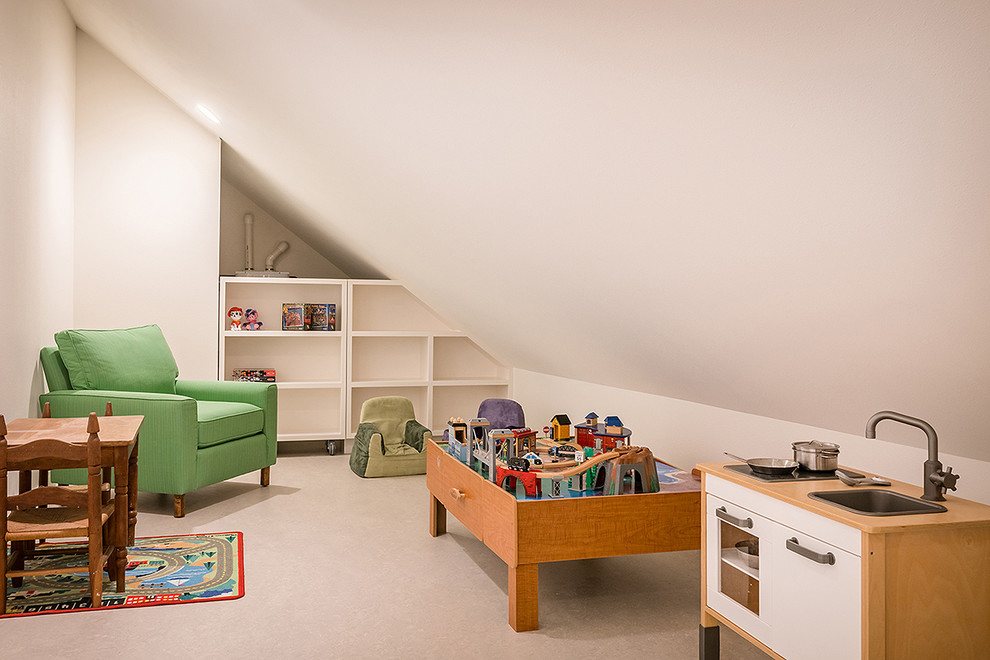 Mid-sized beach style gender-neutral laminate floor and gray floor playroom photo in Seattle with white walls