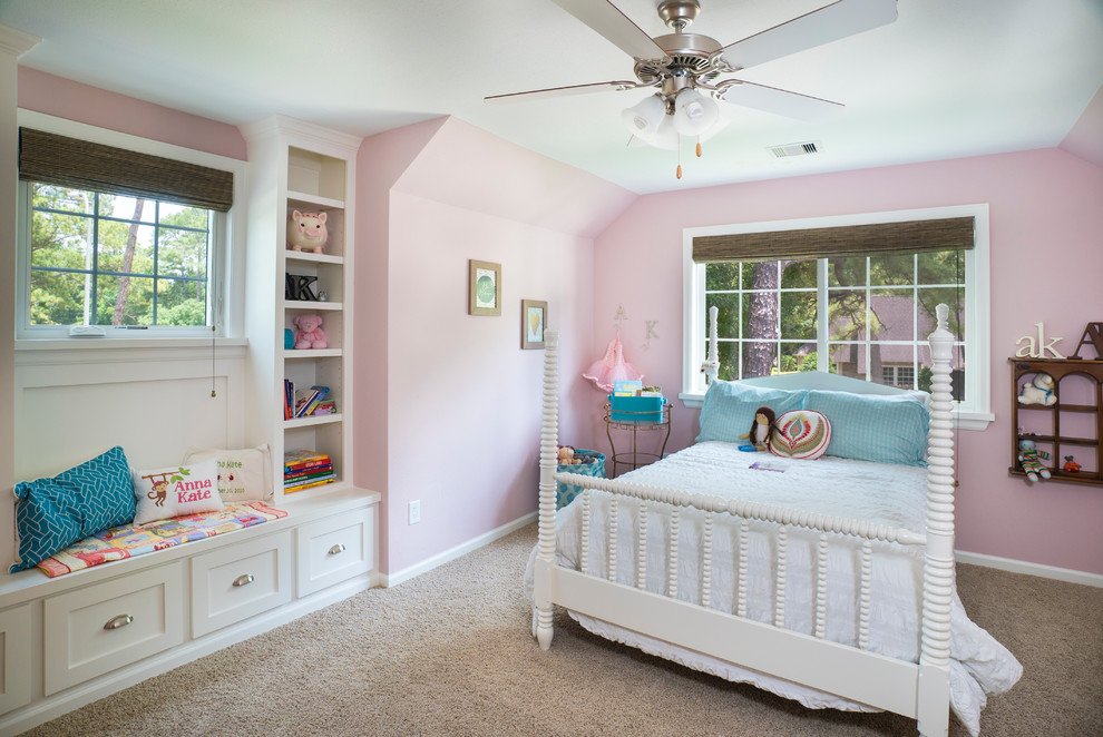 Example of a mid-sized classic carpeted kids' bedroom design in Houston with pink walls