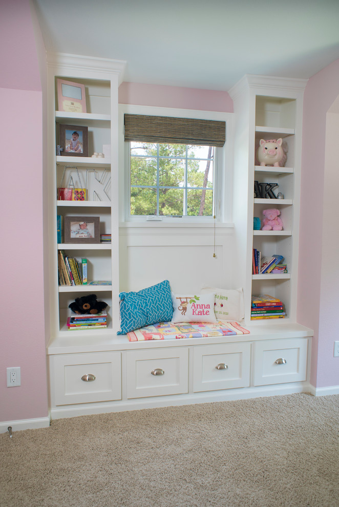 Kids' bedroom - mid-sized traditional carpeted kids' bedroom idea in Houston with pink walls