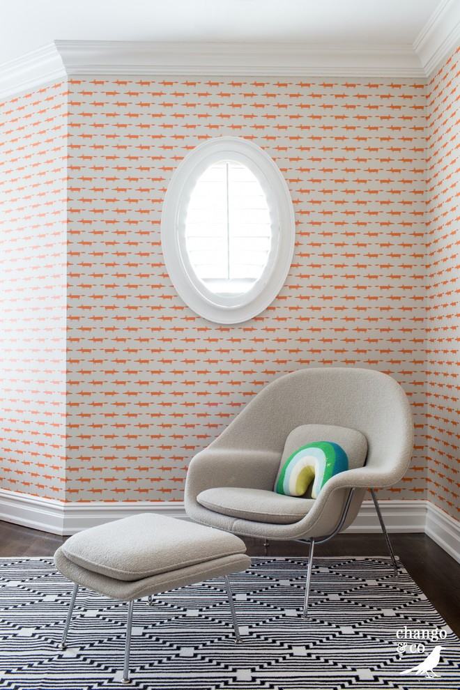 Inspiration for an expansive classic gender neutral children’s room in New York with orange walls, dark hardwood flooring and brown floors.