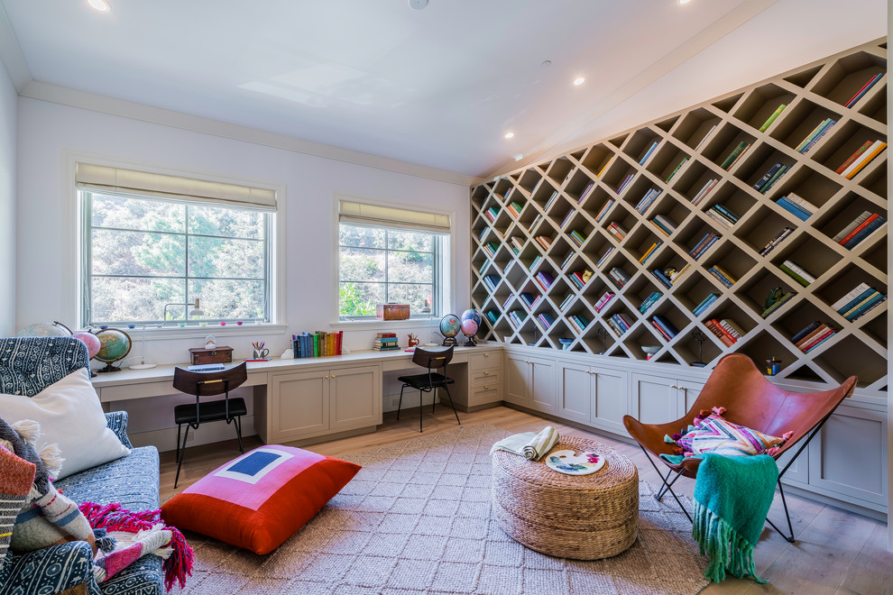 Photo of a classic kids' study space in Los Angeles with white walls and brown floors.