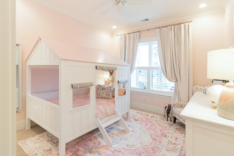 Kids' room - mid-sized transitional girl carpeted and beige floor kids' room idea in Atlanta with pink walls