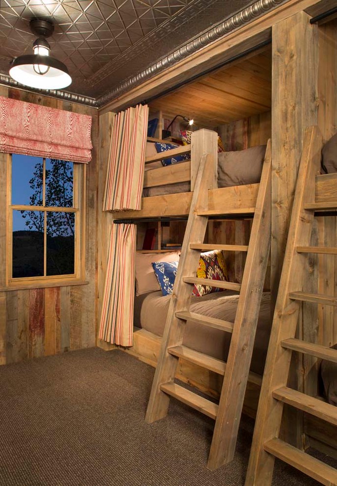 Kids' room - rustic gender-neutral carpeted kids' room idea in Denver
