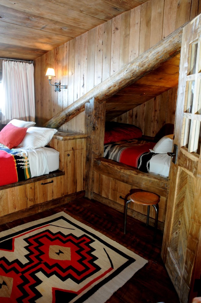 Kids' bedroom - rustic gender-neutral dark wood floor kids' bedroom idea in Atlanta