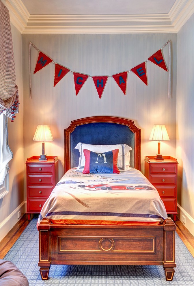Photo of a large traditional kids' bedroom for boys in San Francisco with grey walls, medium hardwood flooring and brown floors.