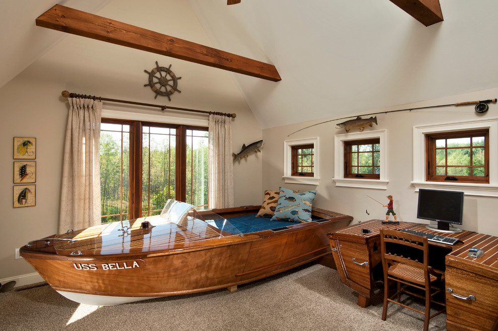 Large nautical children’s room for boys in Boston with beige walls, carpet and brown floors.