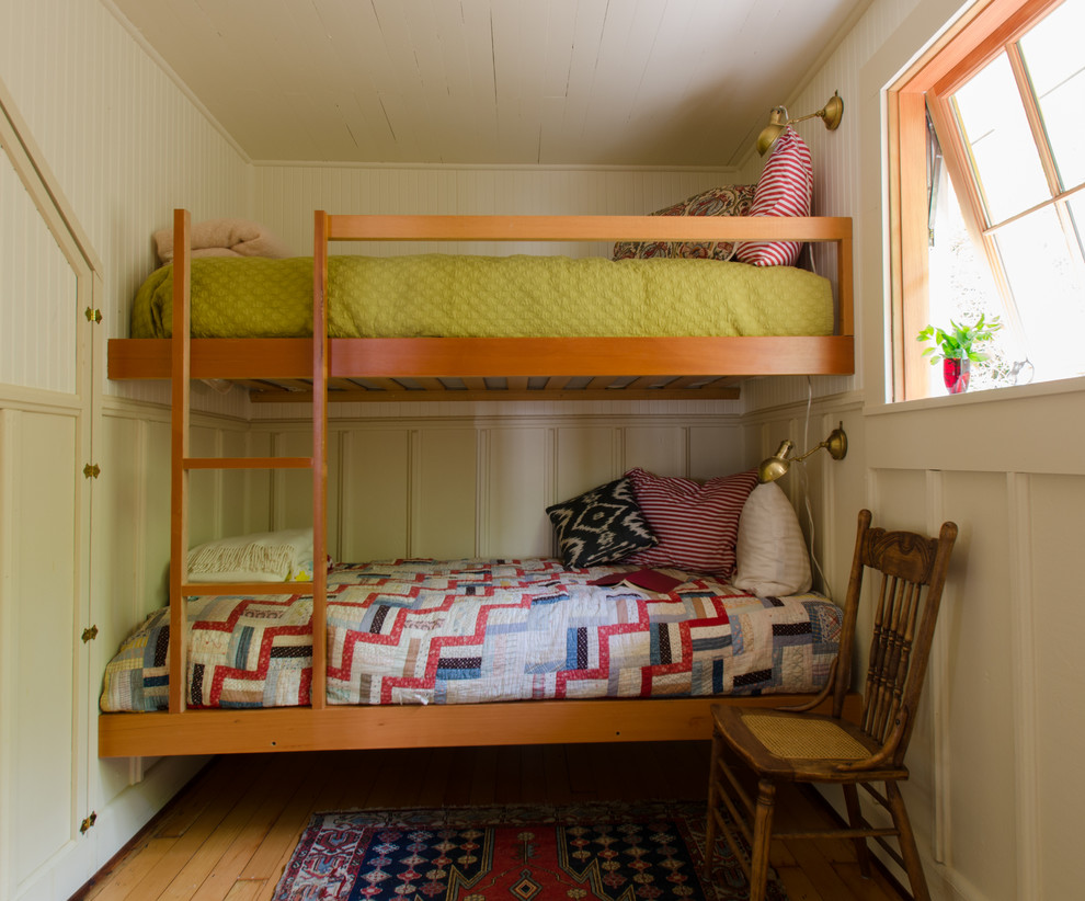 Design ideas for a nautical kids' bedroom in Portland with beige walls and medium hardwood flooring.