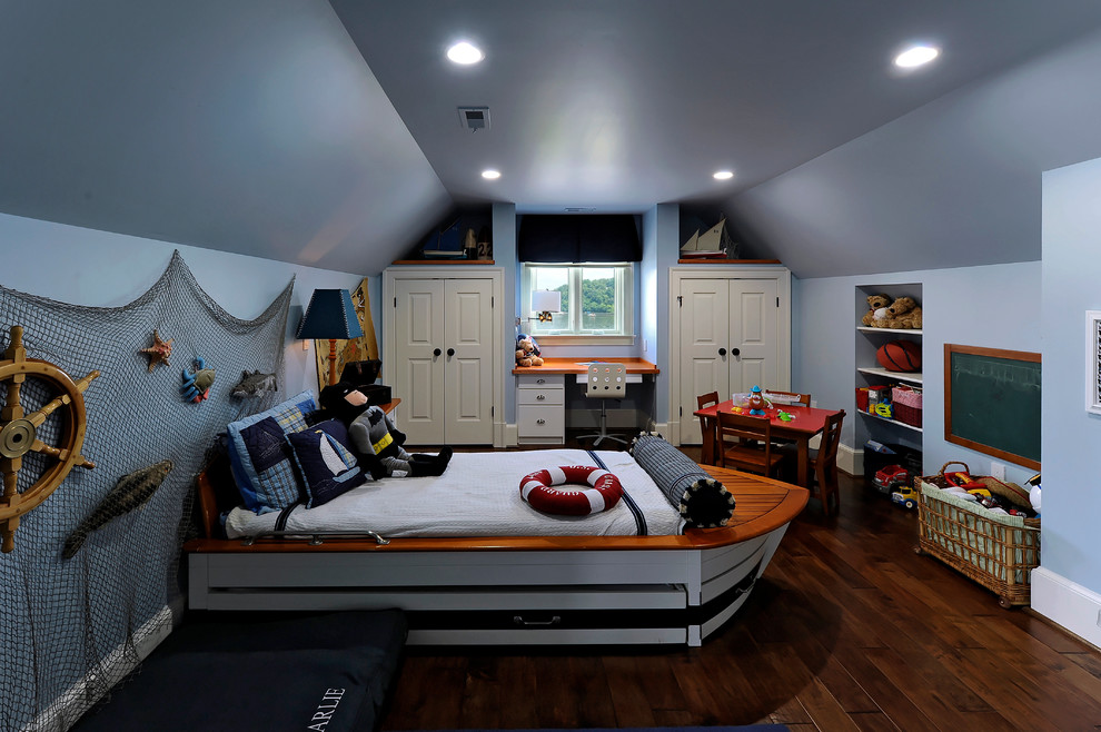 This is an example of a large coastal children’s room for boys in Baltimore with blue walls and dark hardwood flooring.