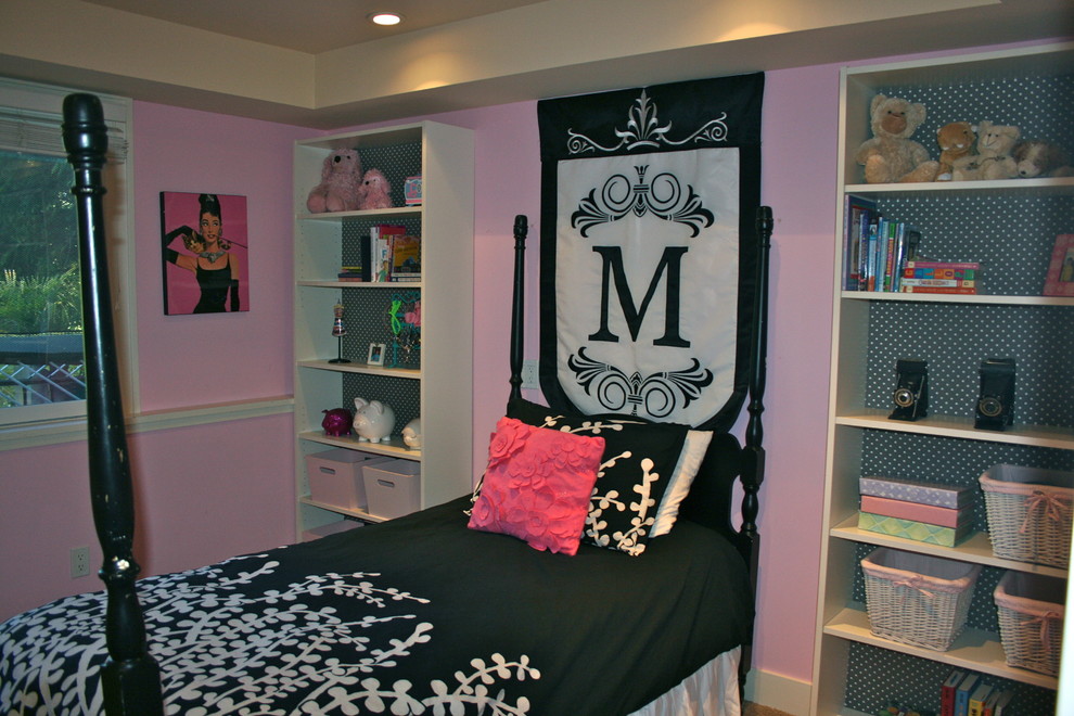 Example of a small classic girl carpeted kids' room design in Seattle with pink walls
