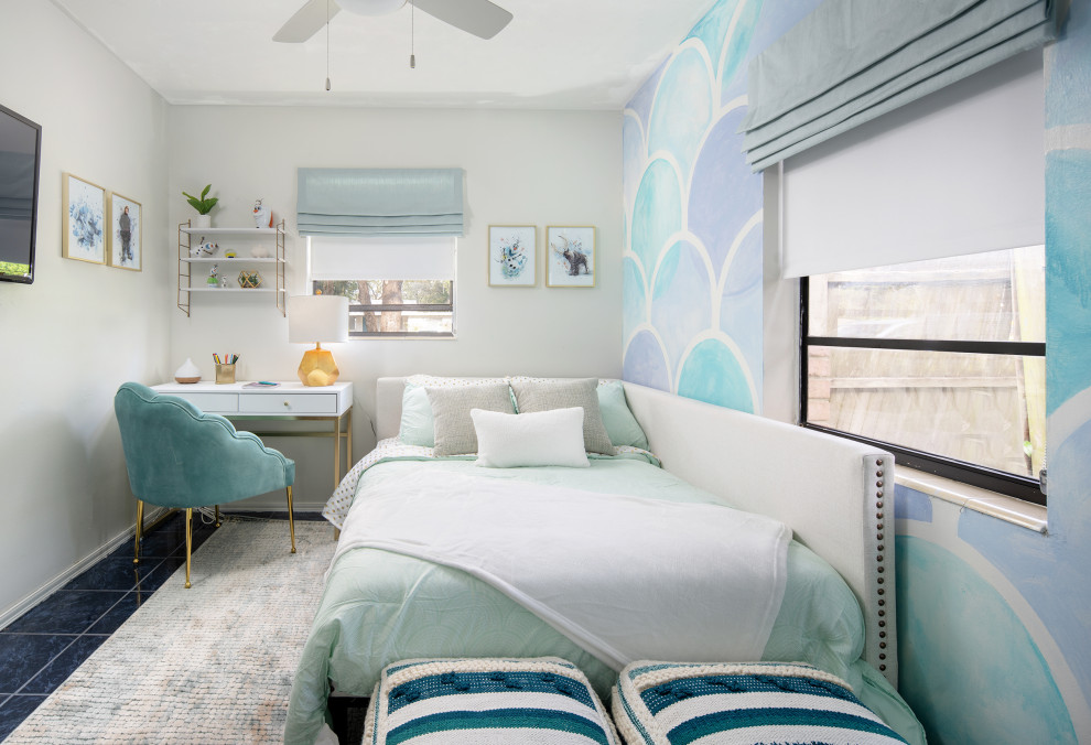 This is an example of a contemporary teen’s room for girls in San Diego with multi-coloured walls and blue floors.