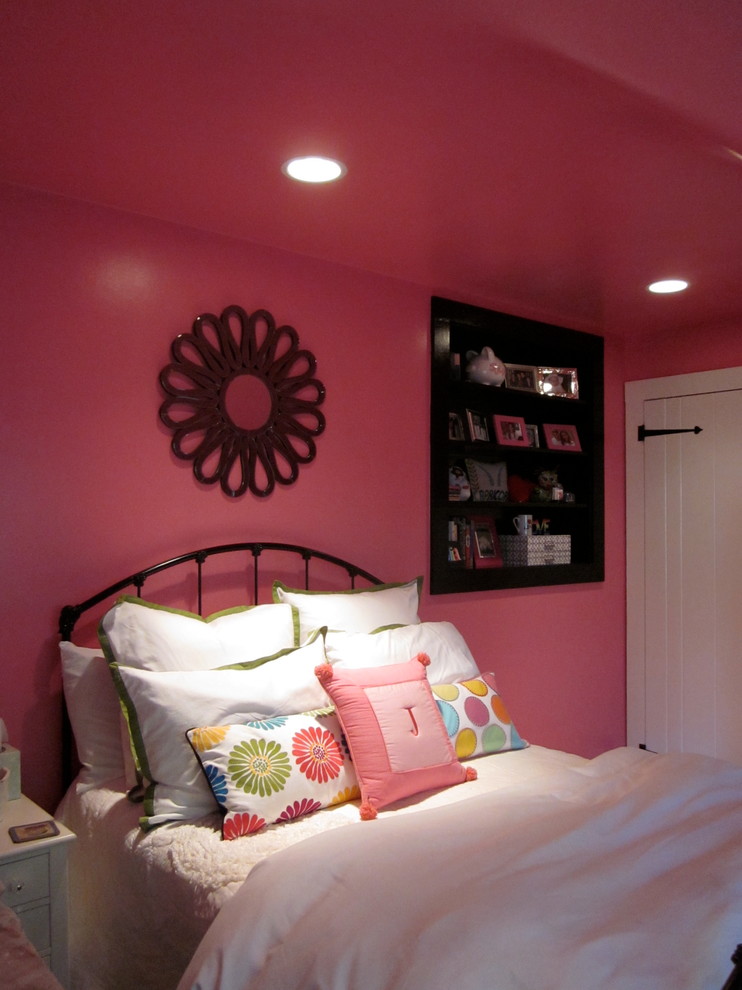 Photo of a medium sized contemporary teen’s room for girls in New York with pink walls and carpet.