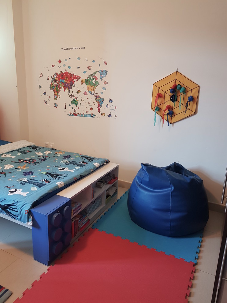 Inspiration for a mid-sized eclectic boy kids' room remodel in Other with beige walls