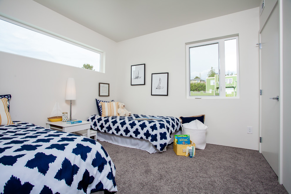 Mid-sized minimalist gender-neutral carpeted kids' room photo in Seattle with white walls