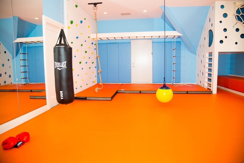 Immagine di una cameretta per bambini da 4 a 10 anni contemporanea di medie dimensioni con pareti blu e pavimento arancione