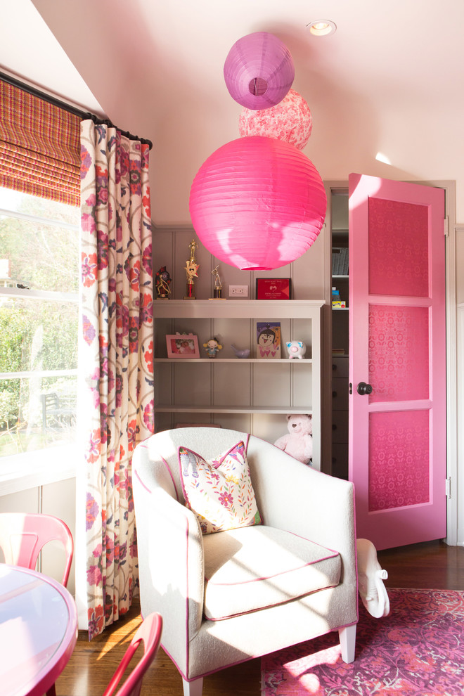 Inspiration for a small classic children’s room for girls in Los Angeles with grey walls and medium hardwood flooring.