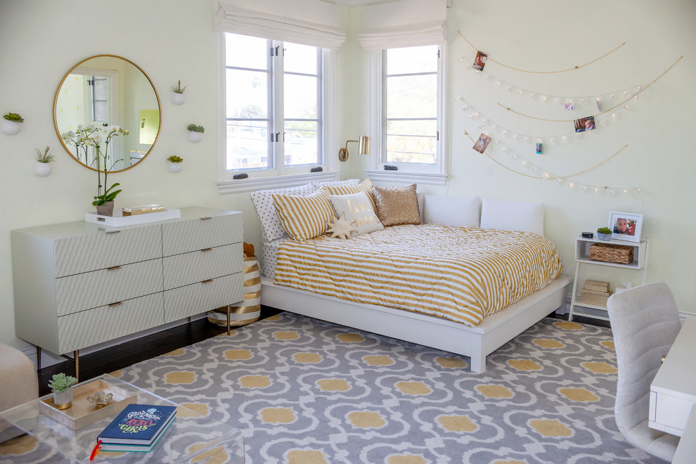 Inspiration for a large contemporary teen’s room for girls in Los Angeles with beige walls, dark hardwood flooring and brown floors.