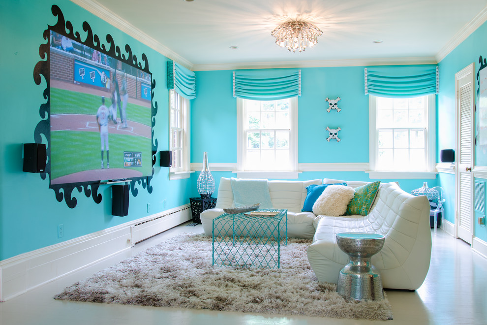 Exemple d'une chambre d'ado tendance avec un mur bleu.