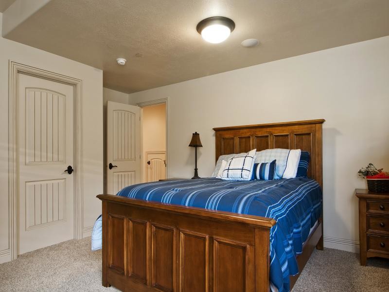 This is an example of a medium sized traditional teen’s room for boys in Salt Lake City with beige walls and carpet.