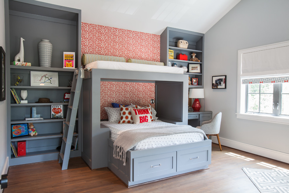 Kids' bedroom - transitional medium tone wood floor kids' bedroom idea in Houston with gray walls