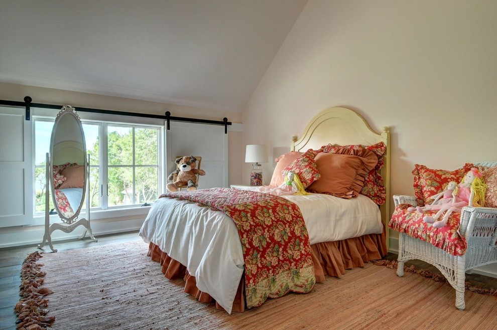 Inspiration for a large country kids' bedroom for girls in Burlington with medium hardwood flooring and beige walls.