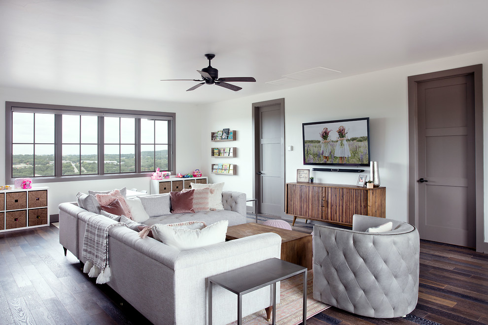 Example of a mid-sized transitional girl dark wood floor and brown floor kids' room design in Austin with white walls