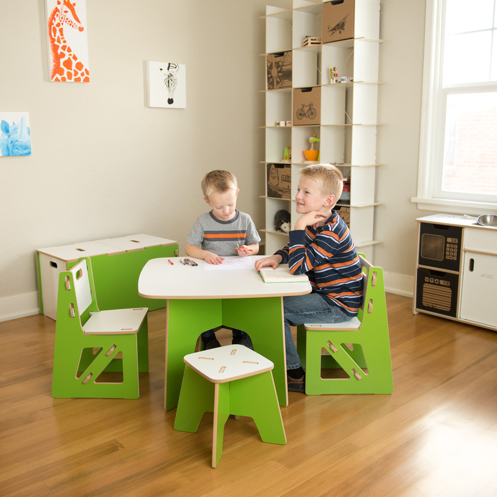 Example of a mid-sized minimalist gender-neutral medium tone wood floor kids' room design in Salt Lake City with white walls