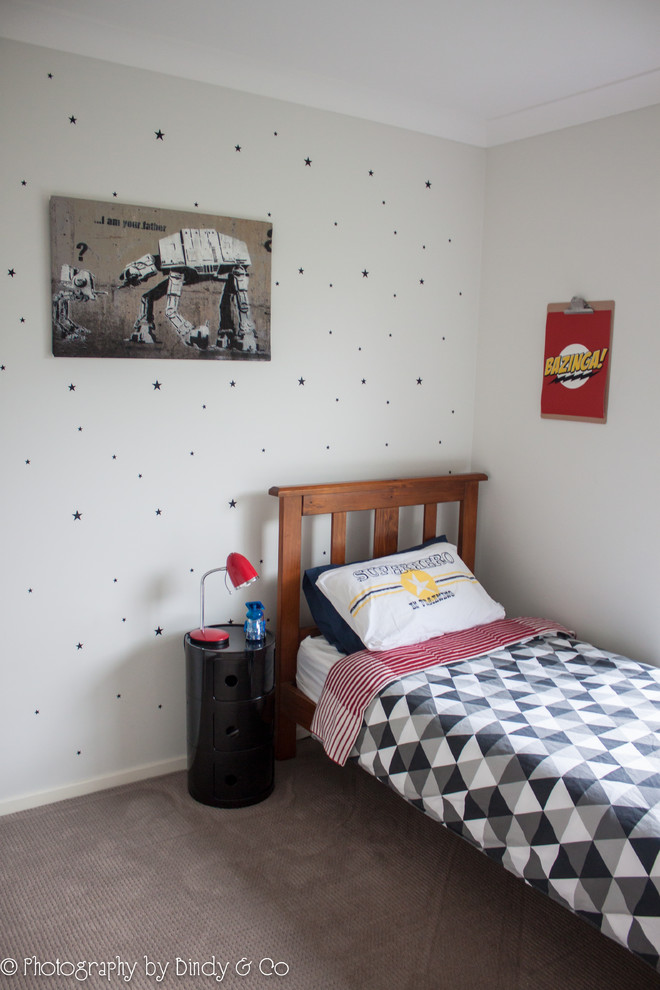 Kids' room - mid-sized modern boy carpeted kids' room idea in Wollongong with white walls