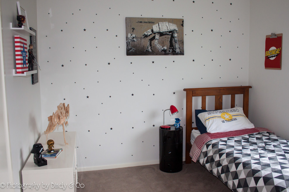 Medium sized modern children’s room for boys in Wollongong with white walls and carpet.