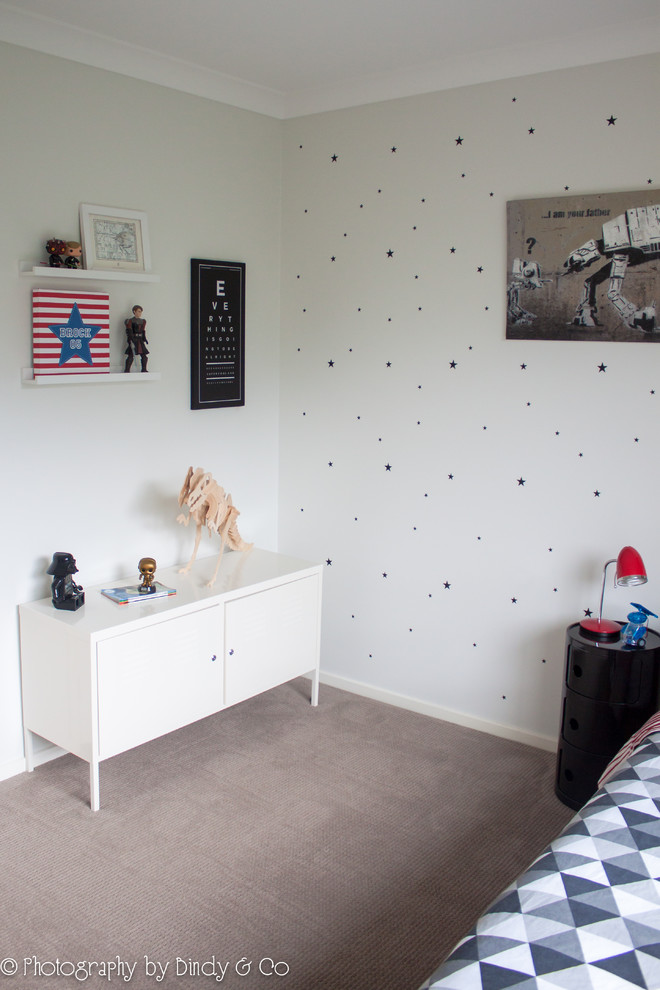 Medium sized modern children’s room for boys in Wollongong with white walls and carpet.