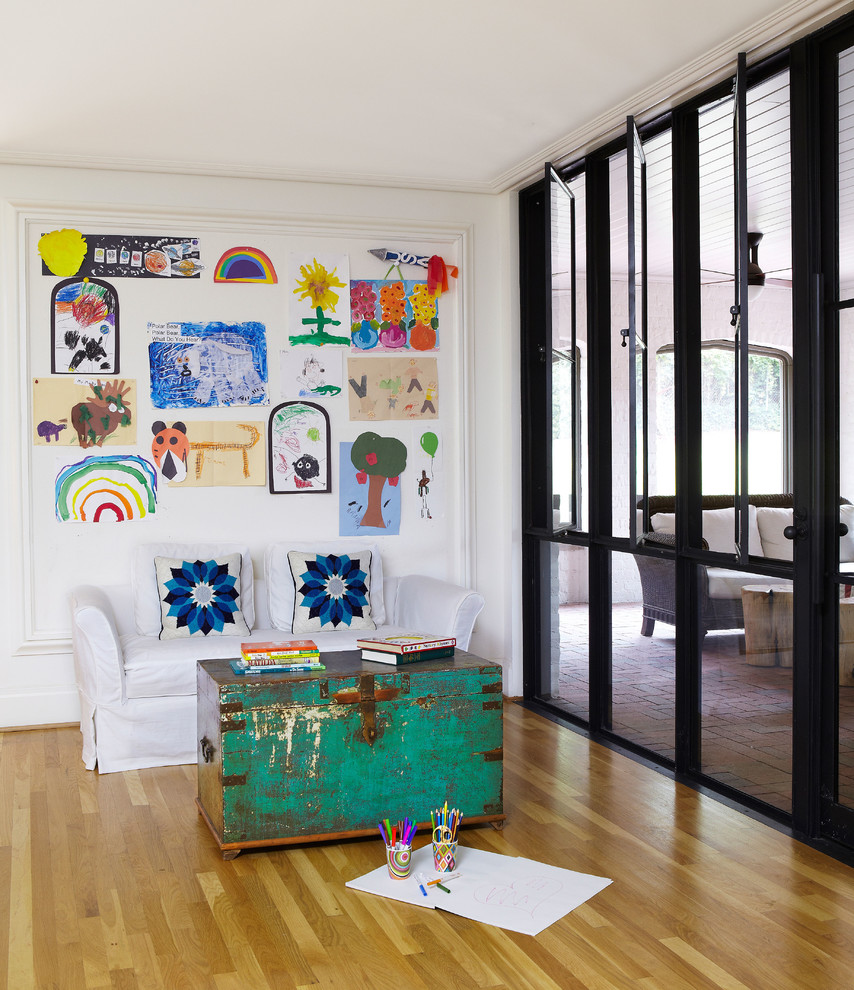 Playroom - contemporary gender-neutral playroom idea in Birmingham with white walls