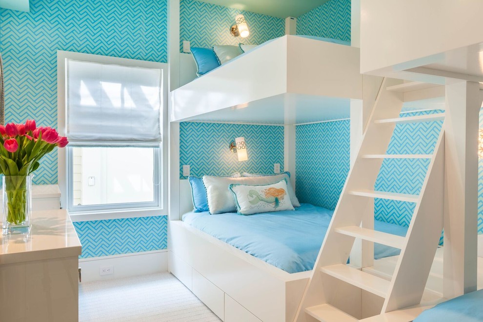 На фото: детская в морском стиле с спальным местом и синими стенами для ребенка от 4 до 10 лет, девочки, двоих детей