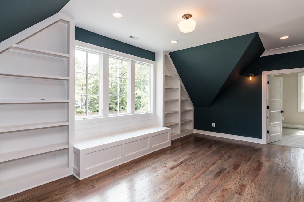 Inspiration for a large cottage gender-neutral medium tone wood floor kids' room remodel in Raleigh with blue walls