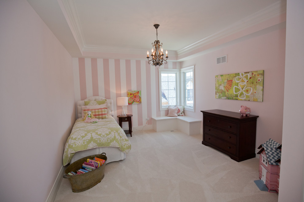 Kids' room - mid-sized traditional girl carpeted and beige floor kids' room idea in Chicago with pink walls