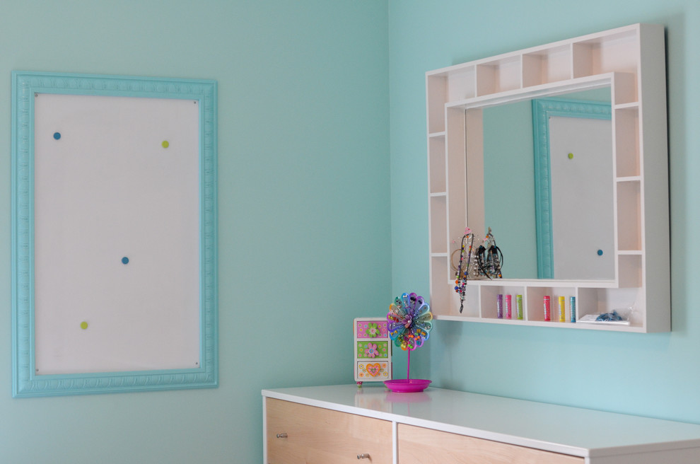 Inspiration for a medium sized classic children’s room for girls in New York with blue walls and dark hardwood flooring.