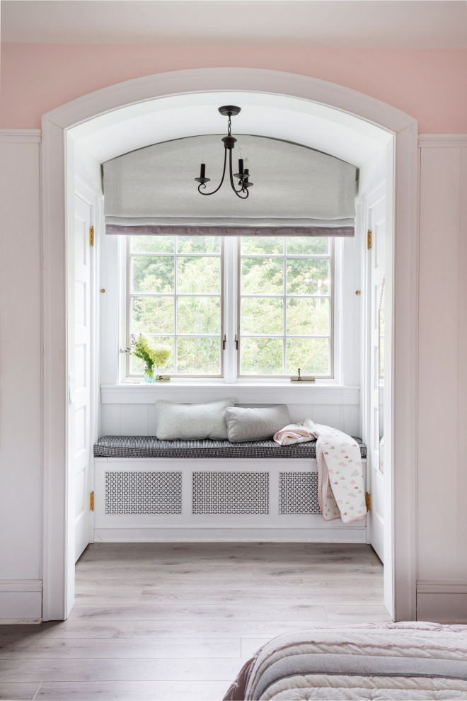 Photo of a classic kids' bedroom for girls in Philadelphia with pink walls, light hardwood flooring, grey floors and tongue and groove walls.
