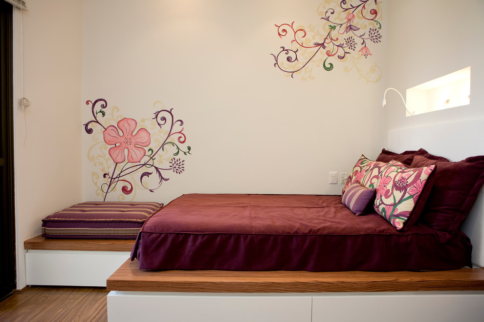 This is an example of a contemporary kids' bedroom in Other with white walls.